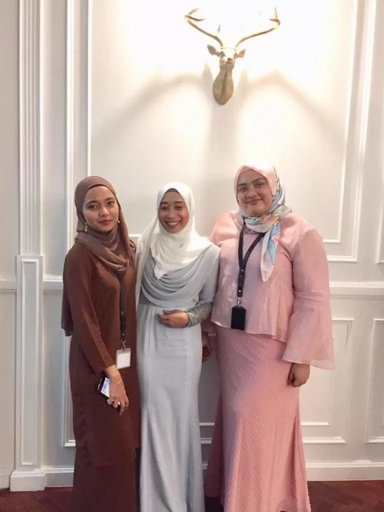 3 women taking a portrait shot after winning a fashion competition for a Hari Raya Aidilfitri celebration at Colony's KLCC event space